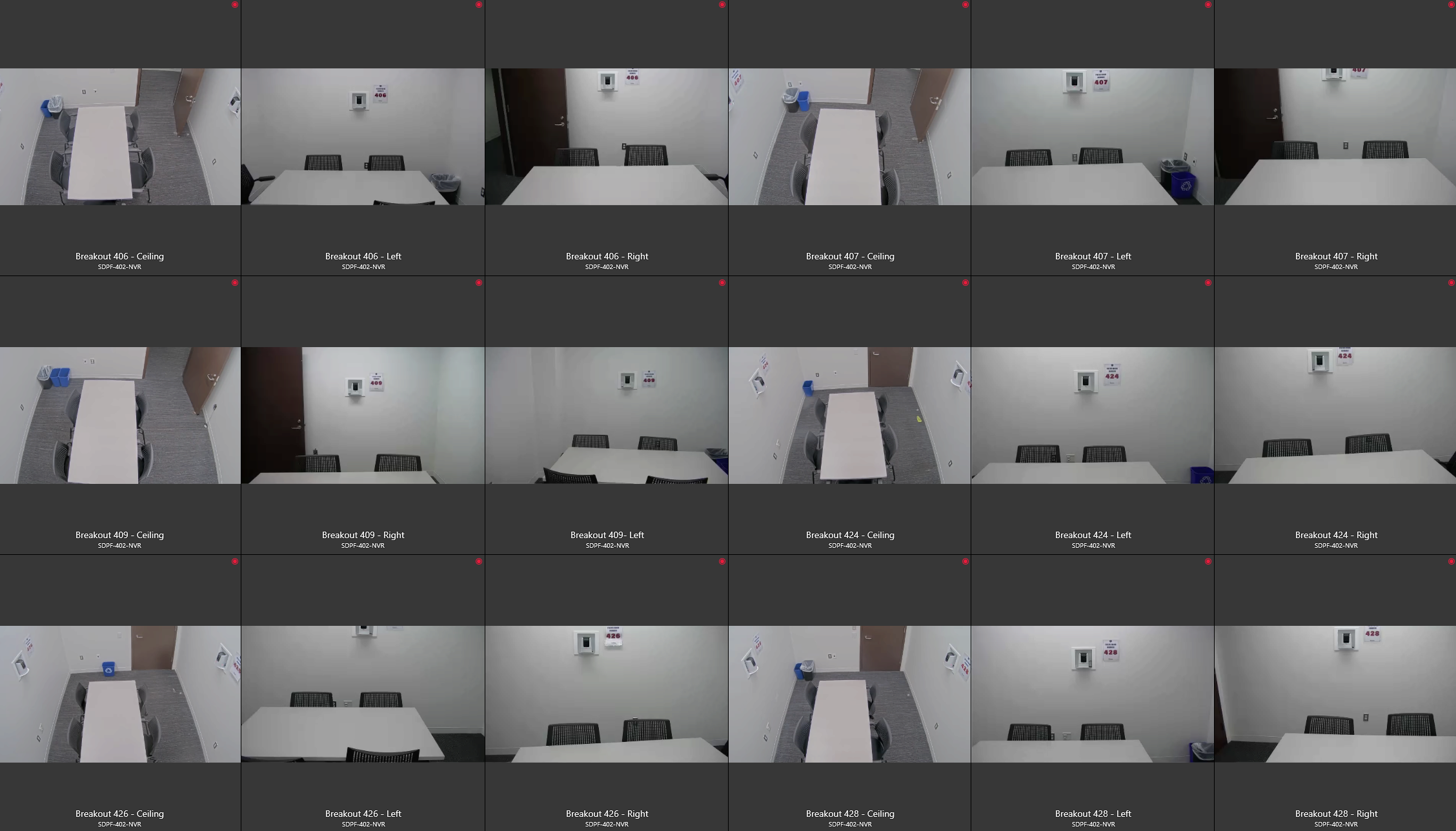 A grid of surveillance camera footage showing different angles of empty breakout rooms. Each room has a table, chairs, and a waste bin.